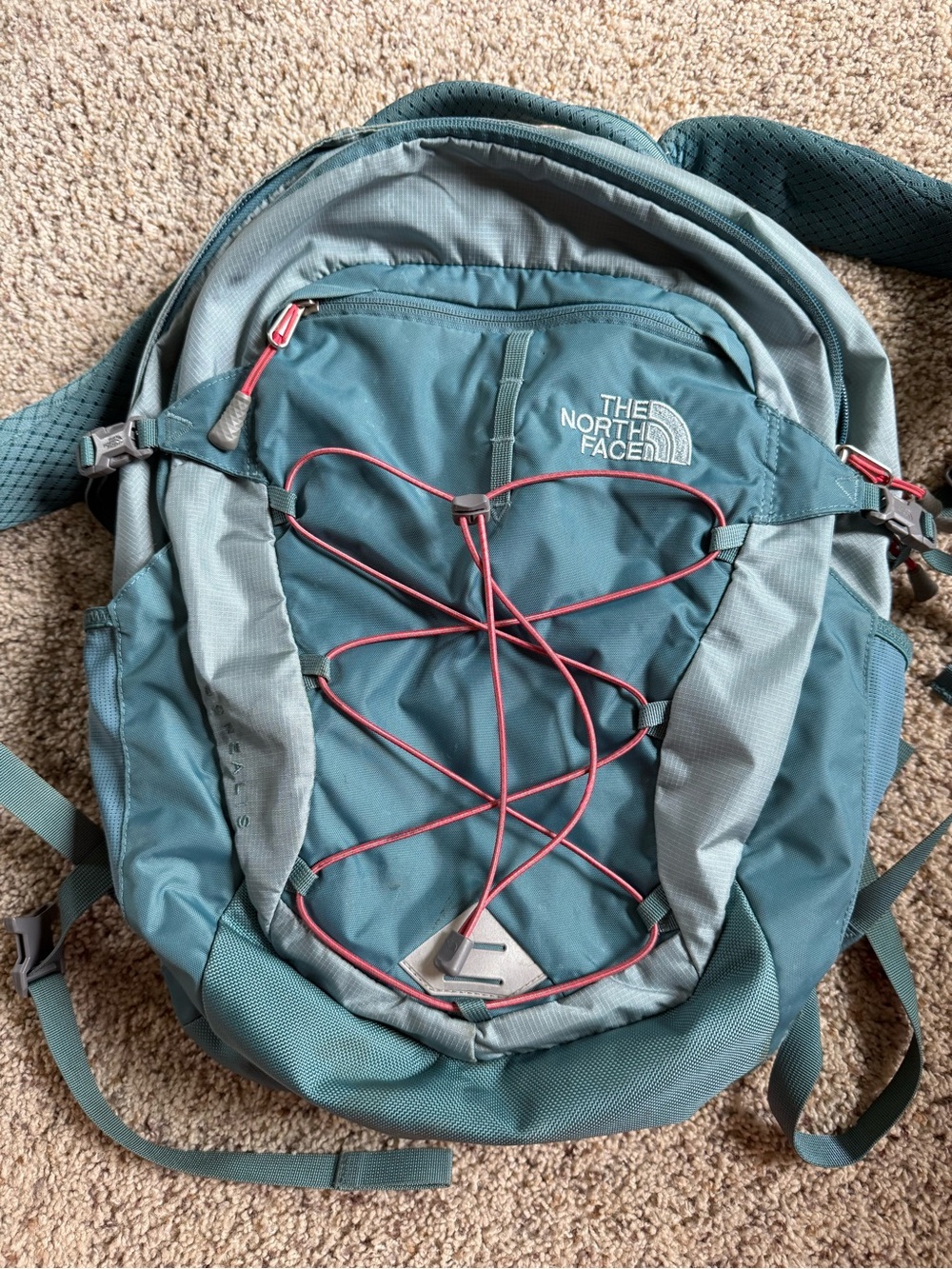 The North Face Borealis Teal Backpack with pink red accent